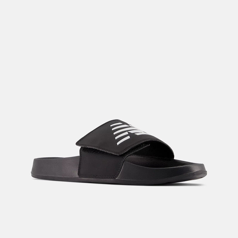 New Balance 200v2 Adjustable slides in black with white branding, adjustable strap and cushioned sole, angled side view.