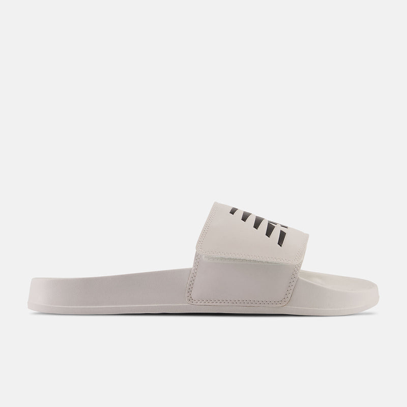 New Balance 200v2 Adjustable slide sandals in off-white with a velcro strap and black detailing, side view.