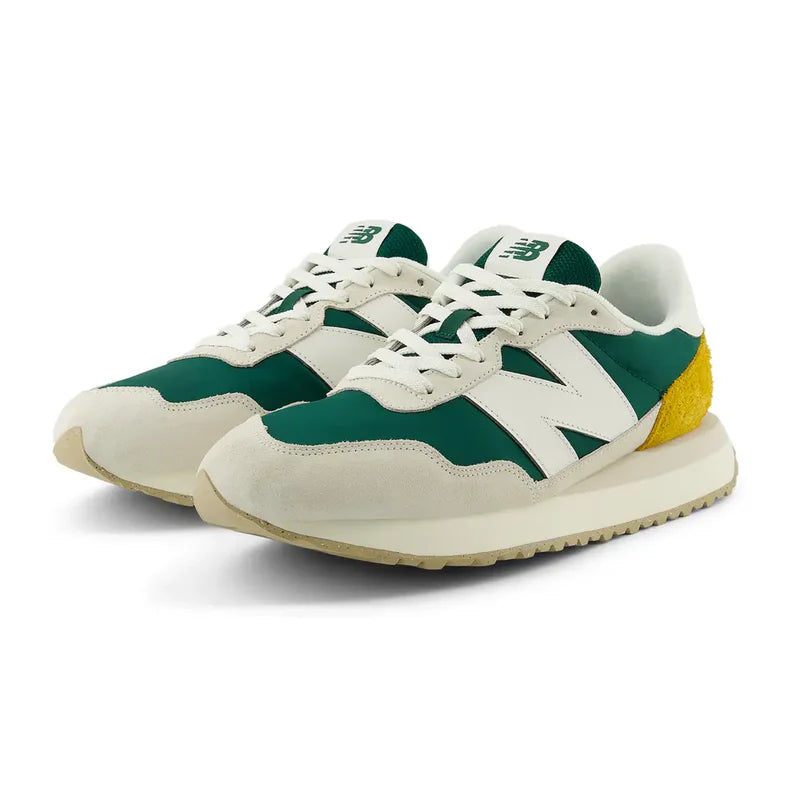New Balance 237 V1 sneakers in green, white, and yellow with suede overlays and retro-inspired design, angled front view.