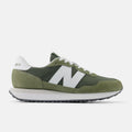 New Balance 237 sneakers in olive green with white accents, suede overlays, and ripstop upper, side view.