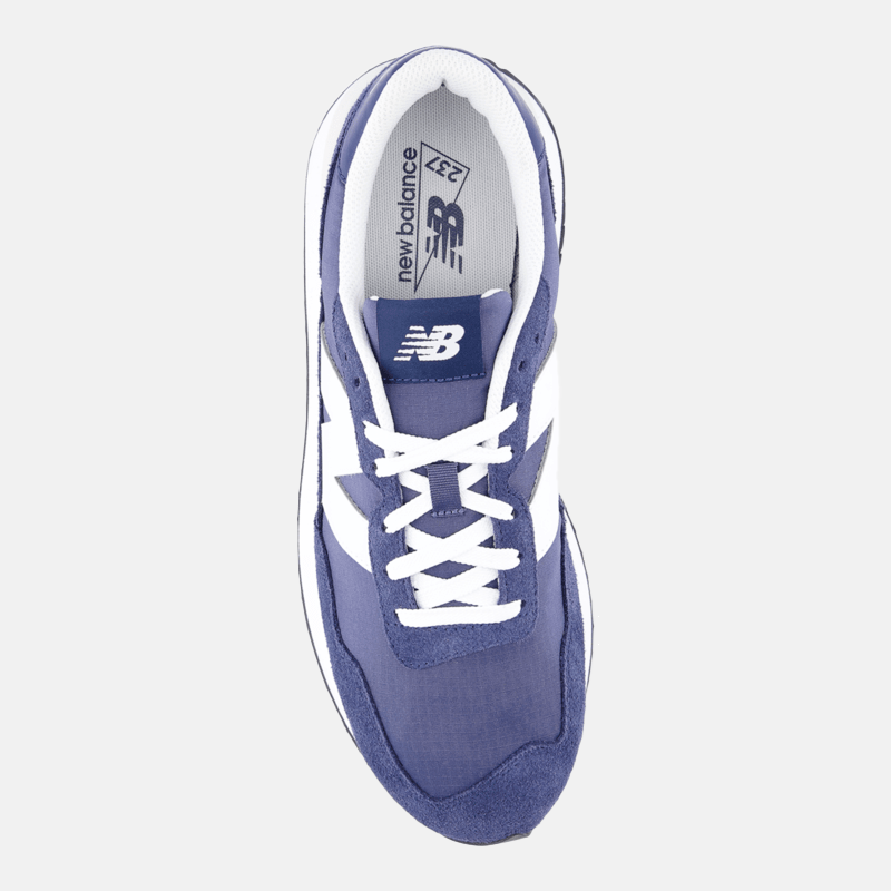 New Balance 237 sneakers in blue with white accents, suede and mesh upper, white laces, and New Balance logo on tongue, top view.