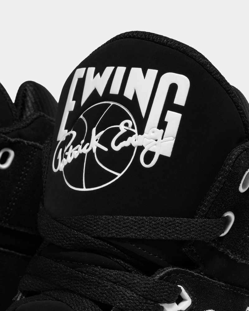 Ewing Athletics 33 HI OG sneakers in black with signature branding, close-up view of tongue and lacing system.