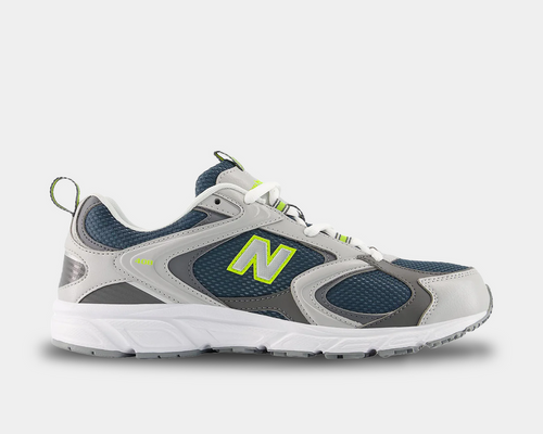 New Balance 408 running shoes in navy blue mesh with gray and white leather overlays, lime green accents, and white sole, side view.