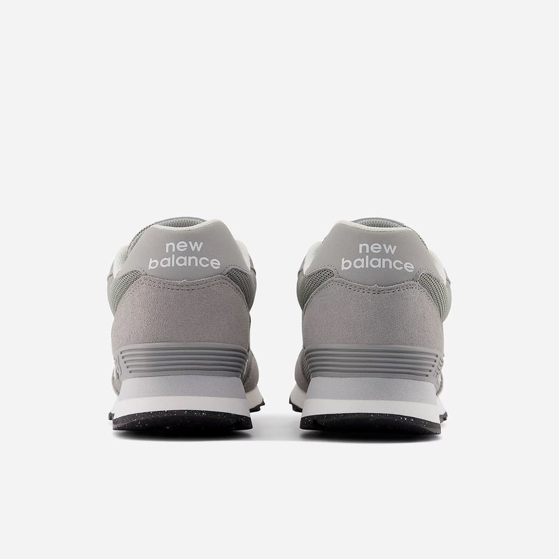New Balance 515 v3 sneakers in gray with suede and mesh upper, back view showing logo detail on heel.