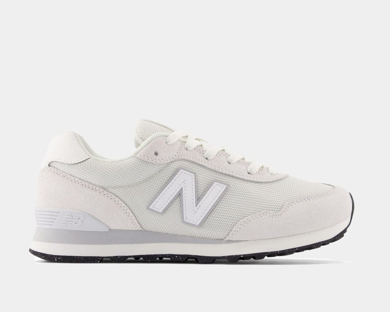 New Balance 515 v3 sneakers in off-white suede and mesh with white logo detailing, side view.
