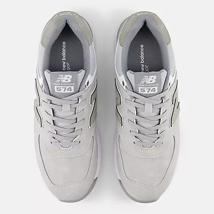 New Balance Golf 574 Greens v2 golf shoes in light gray with suede upper and lace-up closure, top view showing branding on tongue.