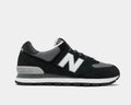 New Balance 574 Rugged shoes in black and gray with suede overlays, mesh panels, ENCAP midsole, and rugged outsole, side view.