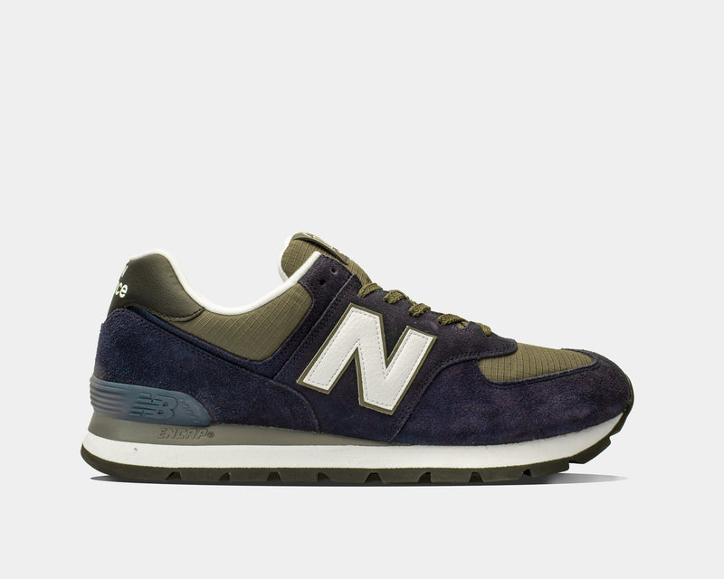 New Balance 574 Rugged sneakers in navy and olive with suede overlays, ripstop mesh accents, and ENCAP midsole, side view.