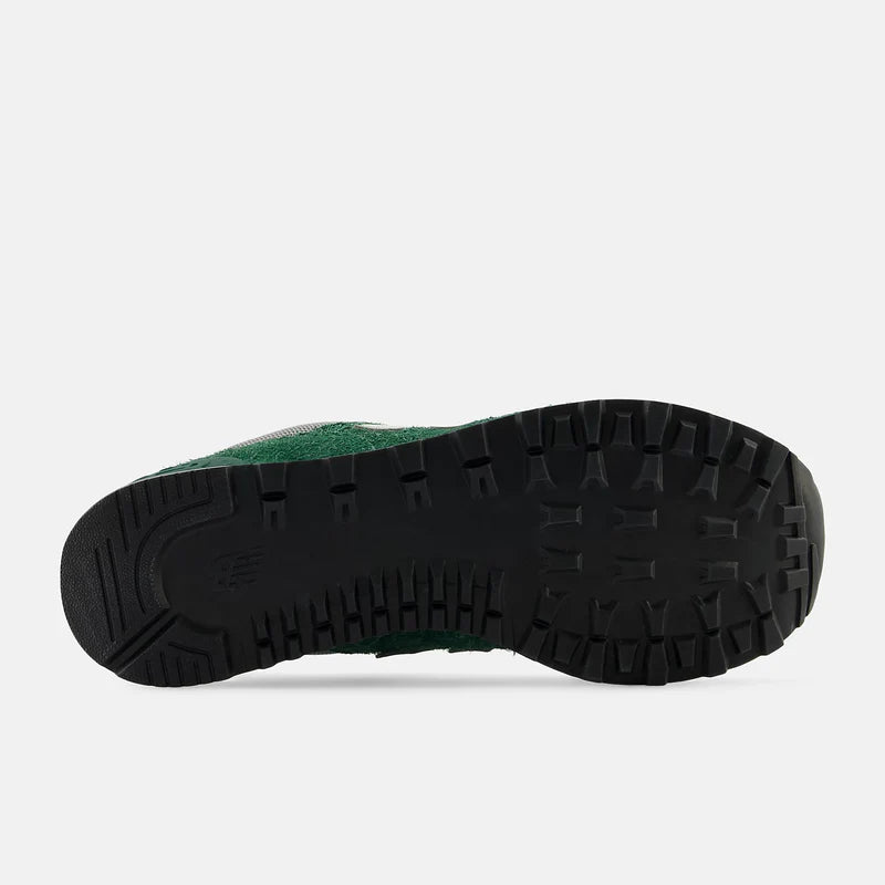 New Balance 574 sneakers outsole in black rubber with textured traction grooves, sole/bottom view.