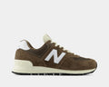 New Balance 574 sneakers in brown suede and mesh with white logo accents, ENCAP midsole, and black rubber outsole, side view.