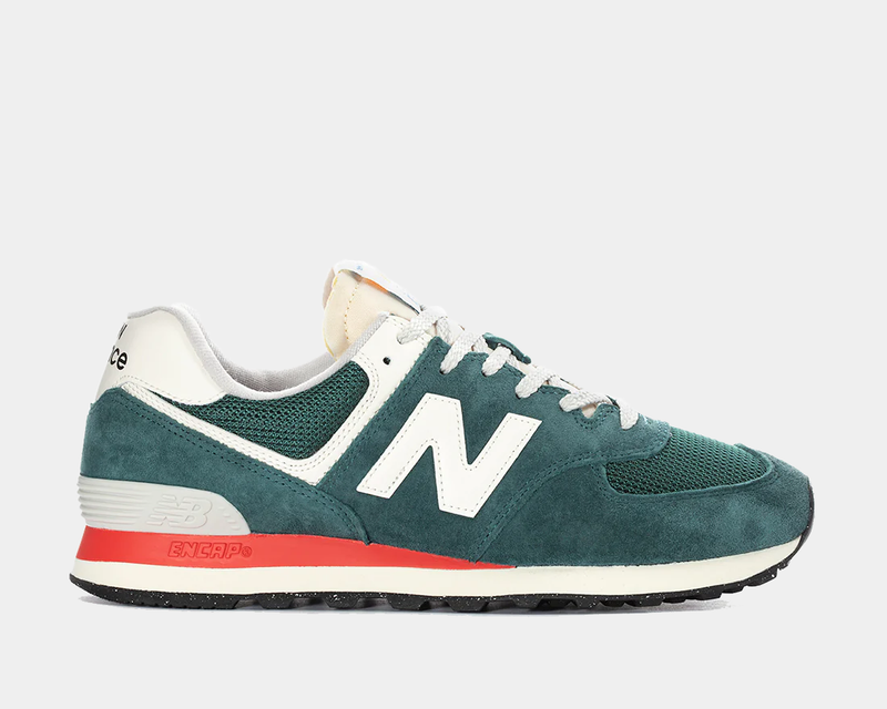New Balance 574 sneakers in green suede and mesh with white logo, red ENCAP midsole, and black outsole, side view.