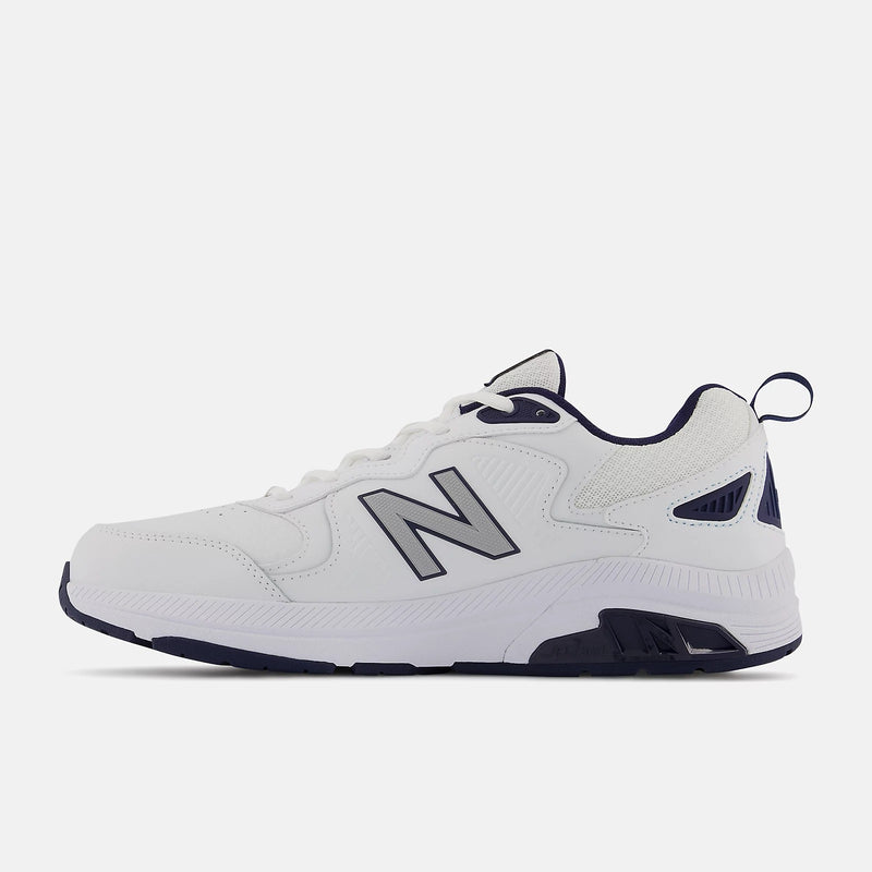New Balance 857v3 training shoes in white with navy blue accents, leather upper, and durable rubber outsole, side view.