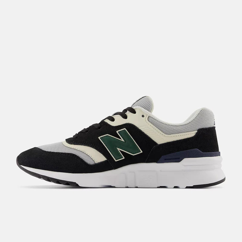 New Balance 997H sneakers in black, cream, and gray with green "N" logo, side profile view showing suede and mesh material.