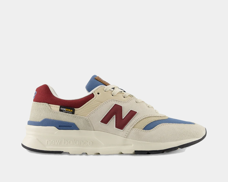 New Balance 997H sneakers in beige, red, and blue with suede and Cordura paneling, side view.