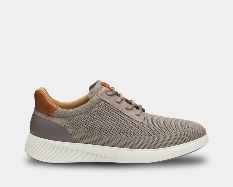 Johnston & Murphy Ackerson Knit Plain Toe shoes in taupe with knit upper, leather accents, and white textured sole, side view.