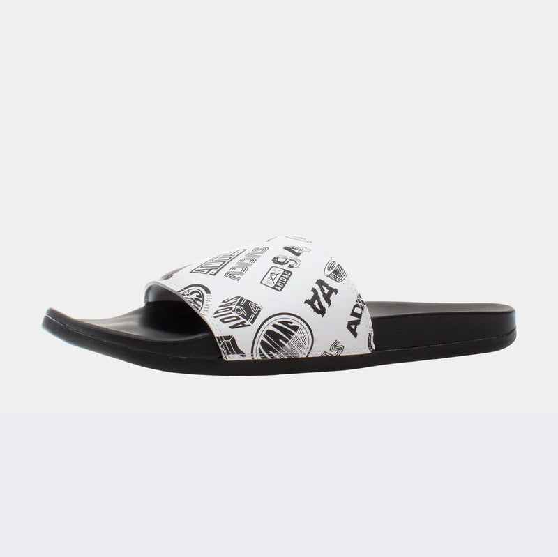 Adidas Adilette Comfort Slides with white printed strap and black footbed, side view.