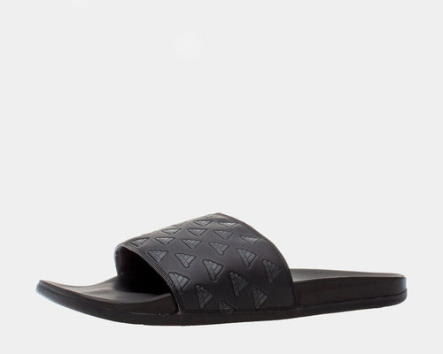 Adidas Adilette Comfort slides in black with embossed Adidas logo design on strap and cushioned footbed, side view.