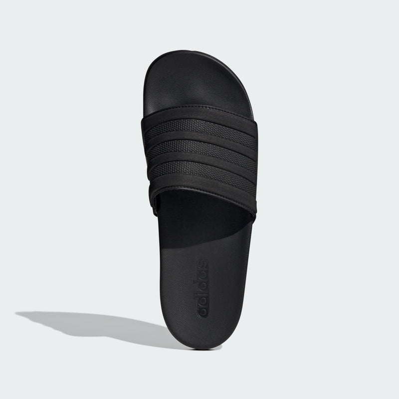 Adidas Adilette Comfort slide sandals in solid black with textured strap and embossed branding, top view.