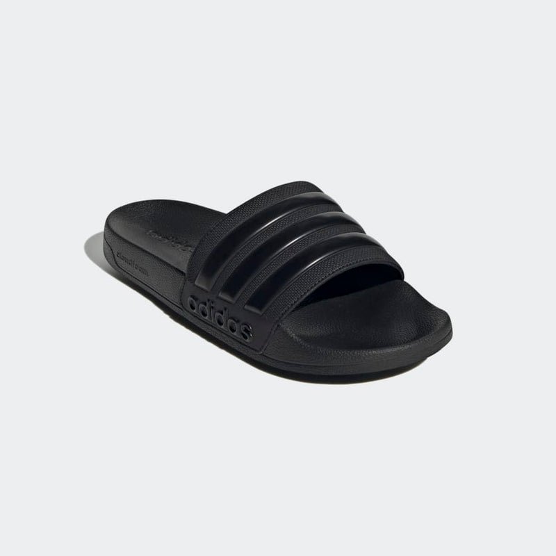 Adidas Adilette Shower Slides in black with textured strap and molded footbed, angled front view.