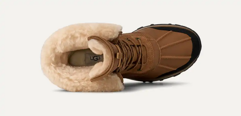 UGG Adirondack Boot XXV winter boots in brown leather with a shearling-lined collar, lace-up closure, and durable sole, top view.