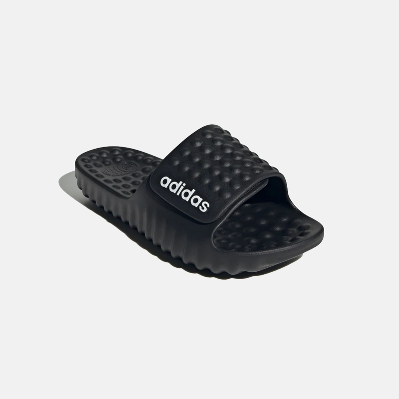 Adidas Adissage 360REC slides in black with textured footbed and cushioned strap featuring white Adidas branding, angled side view.