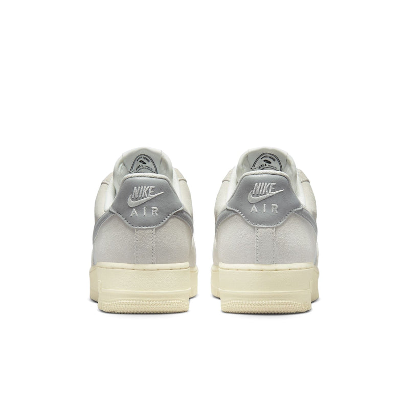 Nike Air Force 1 '07 LV8 sneakers back view, featuring gray suede heel panels with Nike Air branding and cream sole.