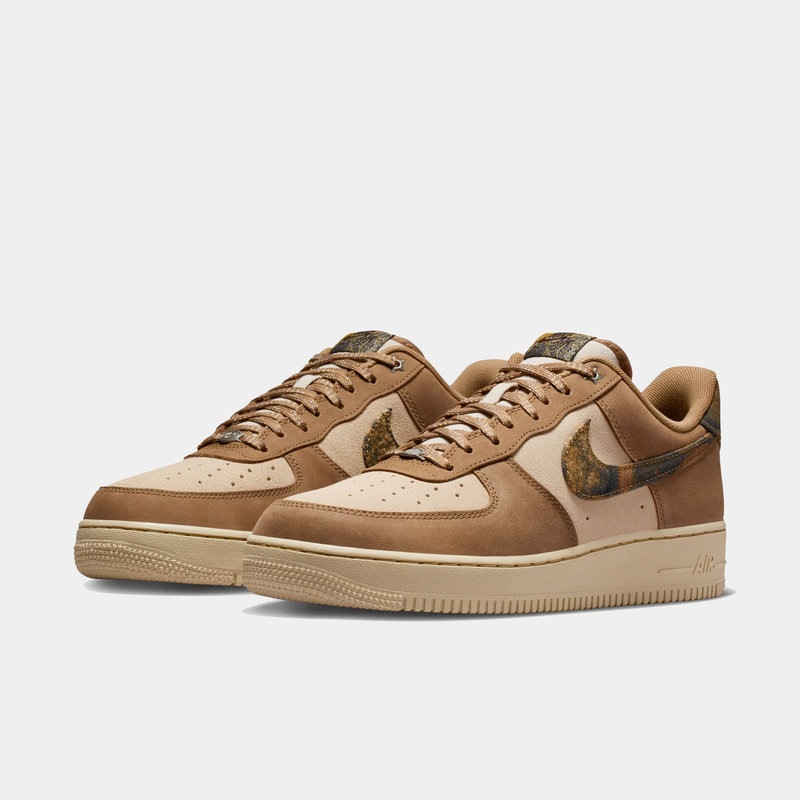 Nike Air Force 1 '07 RealTree sneakers in tan and beige with camouflage Swoosh and suede overlays, front side view.