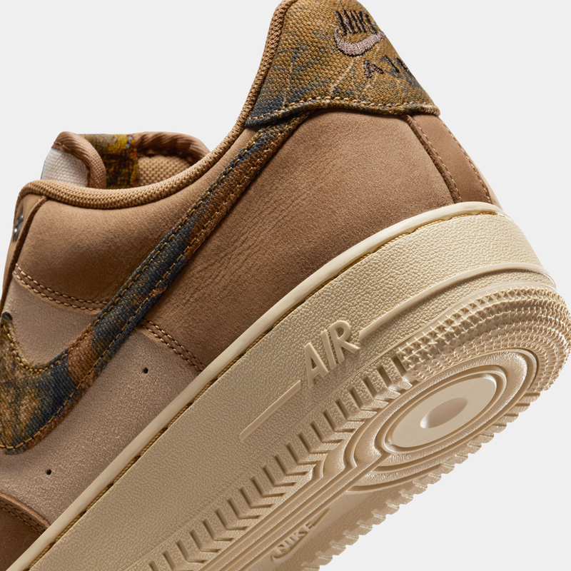 Nike Air Force 1 '07 RealTree sneakers in tan with RealTree camo accents and beige outsole, close-up heel angle.