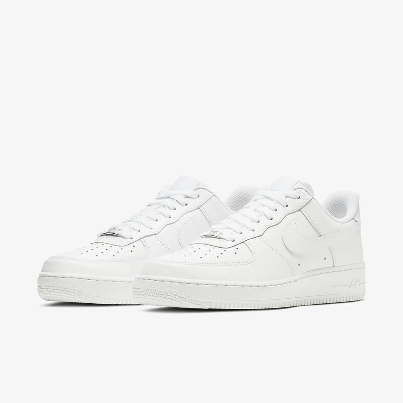 Nike Air Force 1 '07 sneakers in white leather with perforated toe box, signature Swoosh, and cushioned sole, angled front view.
