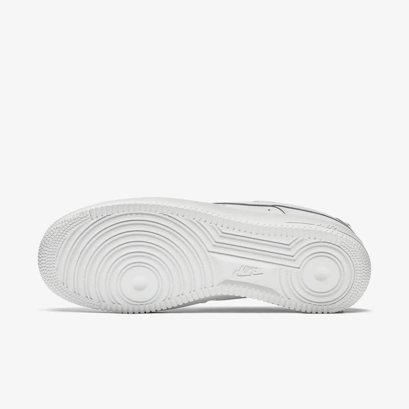 Nike Air Force 1 '07 sneakers outsole in white featuring circular traction pattern and Nike logo, sole/bottom view.