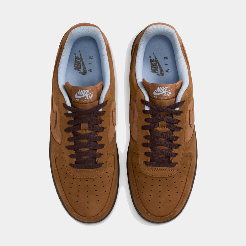 Nike Air Force 1 '07 sneakers, top view showing brown suede uppers, dark brown laces, perforated toe box, and light blue inner lining