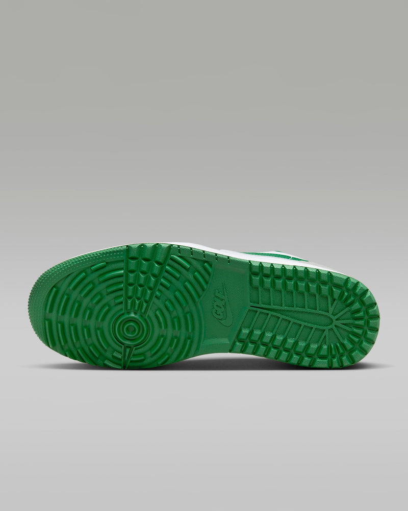Nike Air Jordan 1 Low G golf shoes outsole in green with textured tread pattern and Nike logo, sole/bottom view.