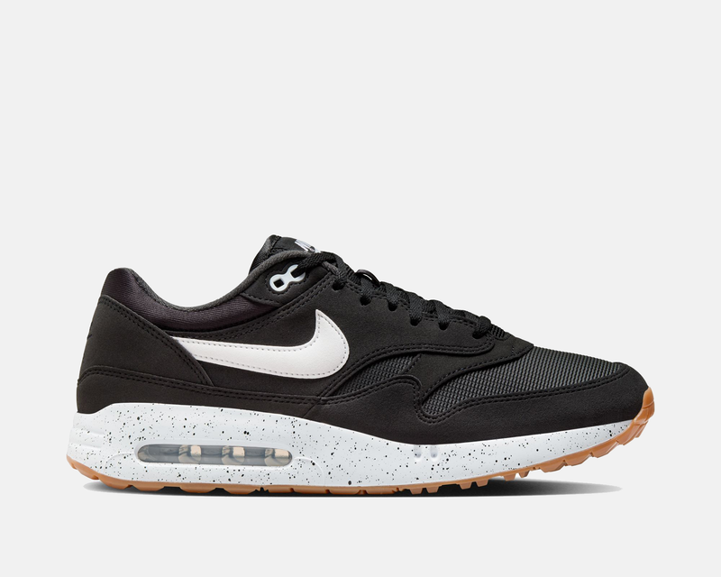 Nike Air Max 1 '86 OG Golf shoes in black with a white Swoosh, speckled midsole, and gum outsole, side view.