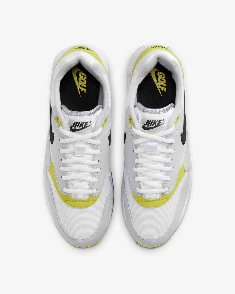 Nike Air Max 1 '86 OG Golf shoes, top view showing white mesh upper with yellow leather overlays, black Swoosh, and branded insoles.