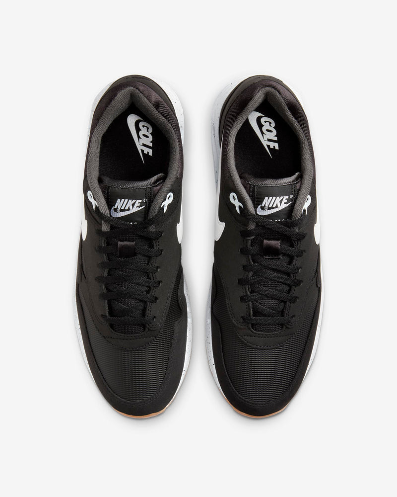 Nike Air Max 1 '86 OG Golf shoes in black with white Swoosh logo, mesh upper, and speckled midsole, top view.