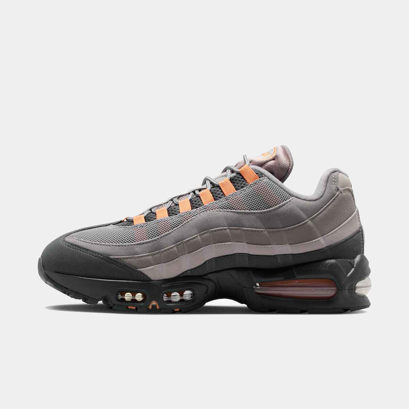 Nike Air Max 95 Big Bubble "OG" sneakers in gray with orange accents and visible Air units, side view.