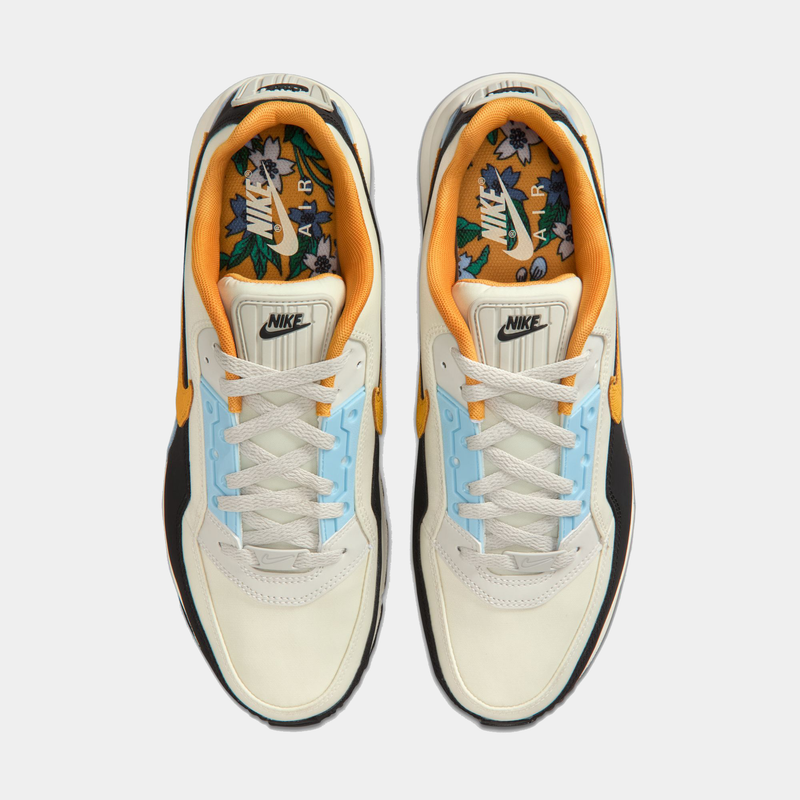 Pair of Nike sneakers with colorful design on a white background