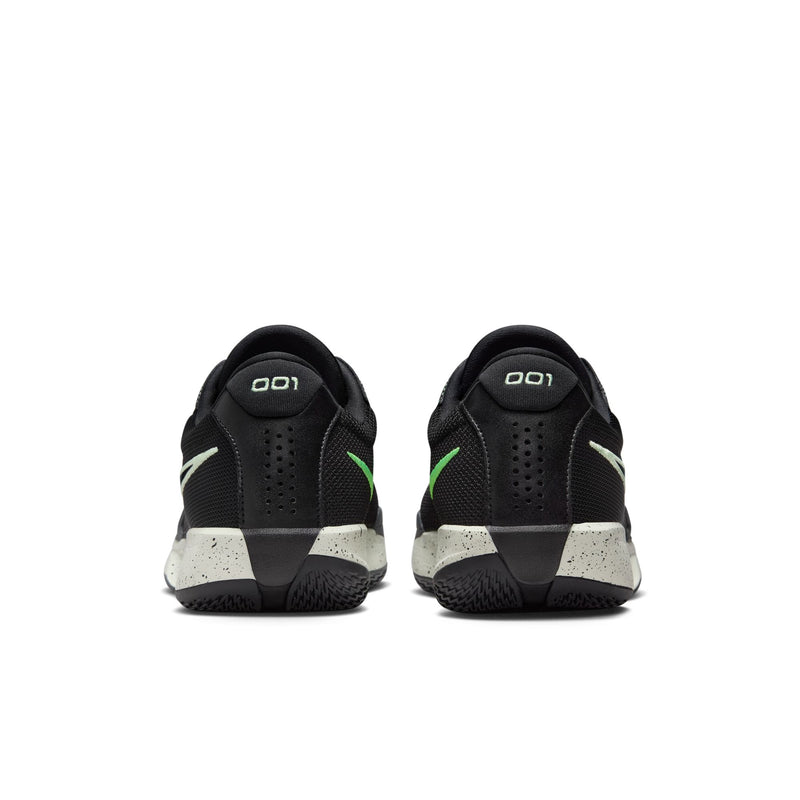 Nike Air Zoom G.T. Cut Academy basketball shoes in black with green accents and speckled white midsoles, back view showing heel details.