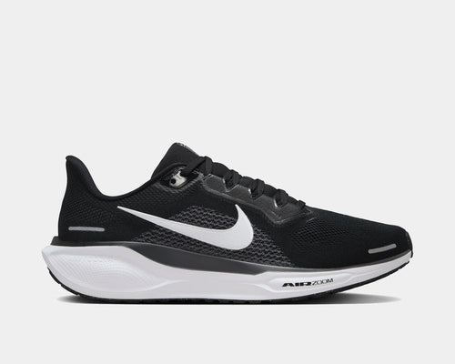A pair of black and white Nike Air Zoom Pegasus 41 running shoes with red accents on a white background.