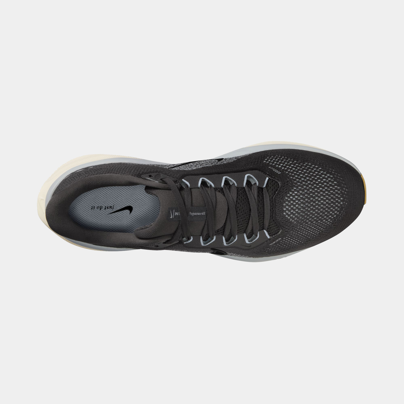 Black running shoe with Nike logo on a light gray background