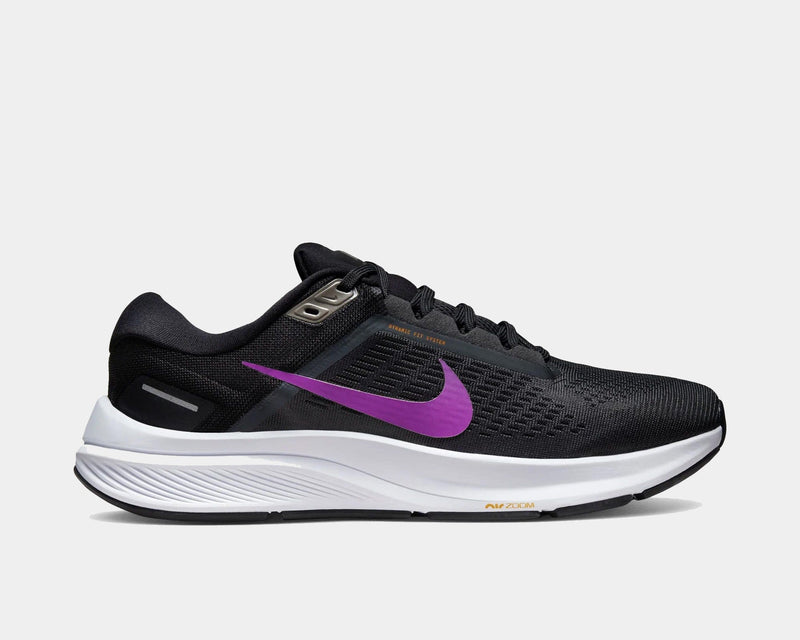 Nike Air Zoom Structure 24 running shoes, side view in black with purple Swoosh logo, breathable mesh upper, and cushioned white midsole.