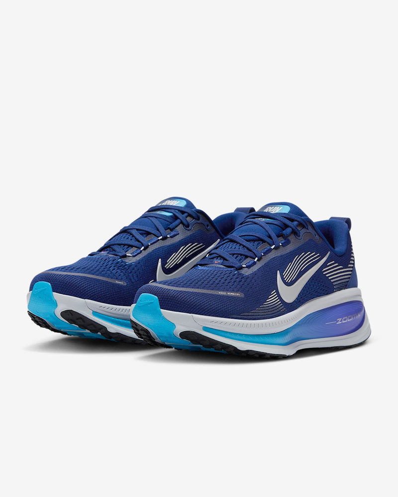 Nike Air Zoom Vomero 18 running shoes in blue with white Swoosh logo, mesh upper, and Zoom Air cushioning, front angle view.
