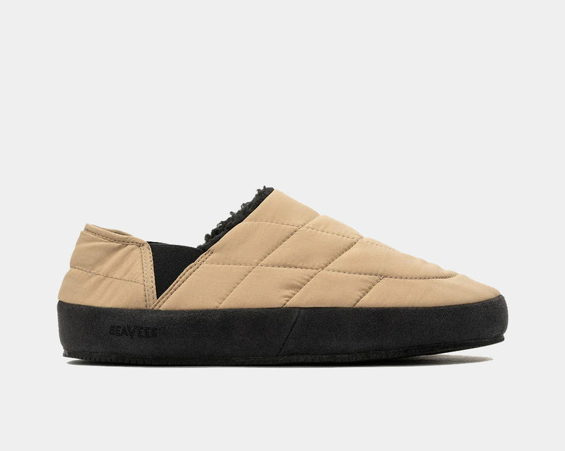 SeaVees Apres Puff Slip On shoes in tan with quilted fabric upper and black midsole, side view.