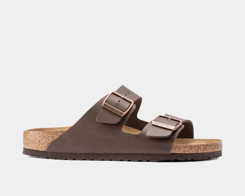 Birkenstock Arizona Birko-Flor® sandals in brown with adjustable straps and copper buckles, side view showing cork footbed and EVA sole.