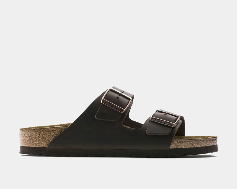 Birkenstock Arizona Oiled Leather sandals in dark brown with dual adjustable straps and cork footbed, side view.