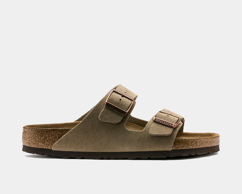 Birkenstock Arizona Soft Footbed Suede sandals in taupe suede with adjustable twin straps and copper buckles, side view.