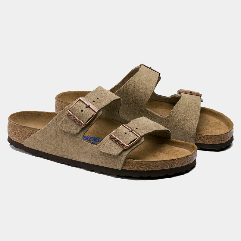 Birkenstock Arizona Soft Footbed Suede sandals in light brown suede with dual adjustable straps and copper buckles, angled side view.