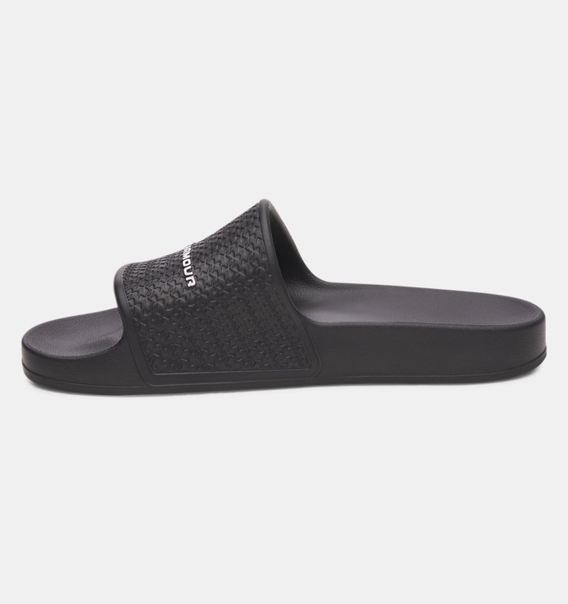 Under Armour ARMR Shower slides in black with textured strap and cushioned footbed, side view.
