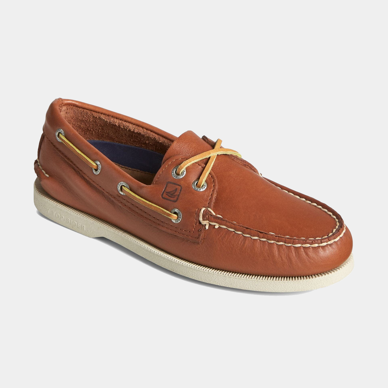 Sperry Authentic Original™ Boat Shoe in classic brown leather with rawhide laces, moccasin construction, and non-slip white rubber sole, angled front view.