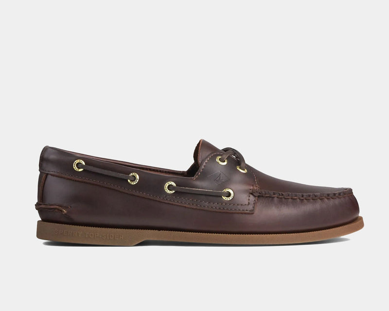 Sperry Authentic Original™ Boat Shoe in dark brown leather with rawhide laces and gold-tone eyelets, side view.